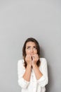 Portrait of a worried young business woman biting nails Royalty Free Stock Photo