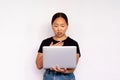 Portrait of worried young woman using laptop Royalty Free Stock Photo