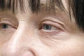 wrinkled face of elderly mature middle aged woman,female eyes with dry skin.cosmetology,skin care