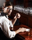 Portrait, writer and man with a notebook, whiskey and creativity with inspiration, journalist and glasses. Face, person