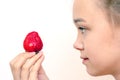 Portrait of yaung woman eating strawberries. Healthy happy smiling woman eating strawberry.