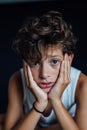 Portrait of a 10 year old boy, painted nails, vertical Royalty Free Stock Photo