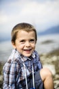 Portrait of a child in front of the lake Maggiore panorama Royalty Free Stock Photo