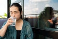 Portrait of a 32 year old Japanese woman drinking a glass of water Royalty Free Stock Photo