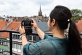 Portrait of a 32 year old Japanese woman, taking a photo with her smartphone Royalty Free Stock Photo