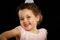 Portrait of 3 year old little girl on black background Royalty Free Stock Photo