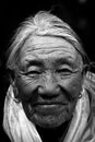 Portrait of an 87 year old woman from Tibet in black and white