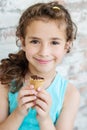 Portrait of 6 years old kid girl eating tasty ice cream