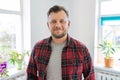 Portrait of 40 years old man, smiling male in plaid casual shirt looking at camera Royalty Free Stock Photo