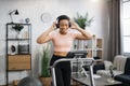 Portrait of young active sporty african american sportive woman in sportswear and headphones Royalty Free Stock Photo