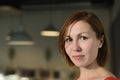 Portrait of young adult asian woman with brown bob hair on blurred interior cafe background Royalty Free Stock Photo