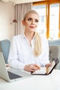 portrait of attractive blonde businesswoman working in home office Royalty Free Stock Photo