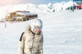 Portrait of young adult beautiful happy caucasian woman smiling near lift station at alpine winter skiing resort. Girl in fashion Royalty Free Stock Photo