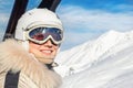 Portrait of young adult beautiful happy caucasian woman smiling on ski-lift at alpine winter skiing resort. Girl in fashion ski Royalty Free Stock Photo
