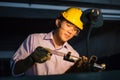 Portrait of young adult experienced industrial asian worker over industry machinery Royalty Free Stock Photo