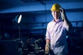 Portrait of young adult experienced industrial asian worker over industry machinery Royalty Free Stock Photo