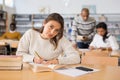 Young adult woman studying in public library Royalty Free Stock Photo