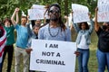 Portrait of african black man protesting outdoors