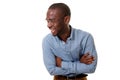 Young african american businessman with glasses laughing with arms crossed against isolated white background Royalty Free Stock Photo