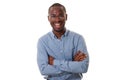 Young african american businessman with glasses smiling with arms crossed against isolated white background Royalty Free Stock Photo