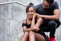 Portrait of young African American couple making funny faces whi