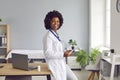 Portrait of a young african american doctor in white medical uniform looking at the camera. Royalty Free Stock Photo
