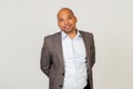 Portrait of a young African American guy businessman smiling, posing looking into the camera. A positive person. Standing on a Royalty Free Stock Photo