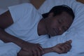 Portrait Of Young African American Man Sleeping In Bed During Night Time Royalty Free Stock Photo