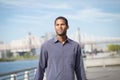 Young African American with the river and bridge in the background Royalty Free Stock Photo