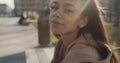 Portrait of young African American woman looking to a camera, outdoors. Slow motion. Royalty Free Stock Photo