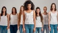 Portrait of young african american woman in white shirt and denim jeans looking at camera. Group of diverse women posing Royalty Free Stock Photo