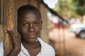 Portrait of a young african boy at the entrance of his home in the town of Nhacra in Guinea Bissau