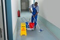 Male Janitor Cleaning Floor Royalty Free Stock Photo