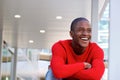 Portrait of young african man laughing with crossed arms Royalty Free Stock Photo