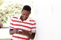 Young african man using cell phone outside Royalty Free Stock Photo