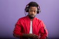 Portrait of young african man listening to music with headphones Royalty Free Stock Photo