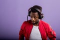 Portrait of young african man listening to music with headphones Royalty Free Stock Photo