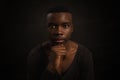 Portrait of Young African man, looking at camera with serious expression