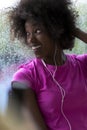 Portrait of young afro american woman in gym while listening mus Royalty Free Stock Photo