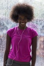 Portrait of young afro american woman in gym while listening mus Royalty Free Stock Photo