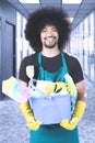 Afro janitor stands in the office corridor Royalty Free Stock Photo