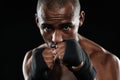 Portrait of young afroamerican boxer, showing his fists