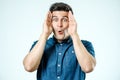 Portrait of young amazed man isolated on gray Royalty Free Stock Photo