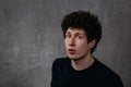 Portrait of young amazed man isolated on gray background Royalty Free Stock Photo