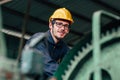 Portrait of young American happy worker enjoy happy smiling to work in a heavy industrial factory Royalty Free Stock Photo