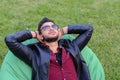 Portrait of Young Arabic Male Man, Student Lies on Chair, Smilin Royalty Free Stock Photo