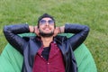 Portrait of Young Arabic Male Man, Student Lies on Chair, Smilin Royalty Free Stock Photo