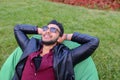 Portrait of Young Arabic Male Man, Student Lies on Chair, Smilin Royalty Free Stock Photo