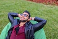 Portrait of Young Arabic Male Man, Student Lies on Chair, Smilin Royalty Free Stock Photo