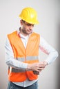 Portrait of young architect checking wrist watch Royalty Free Stock Photo